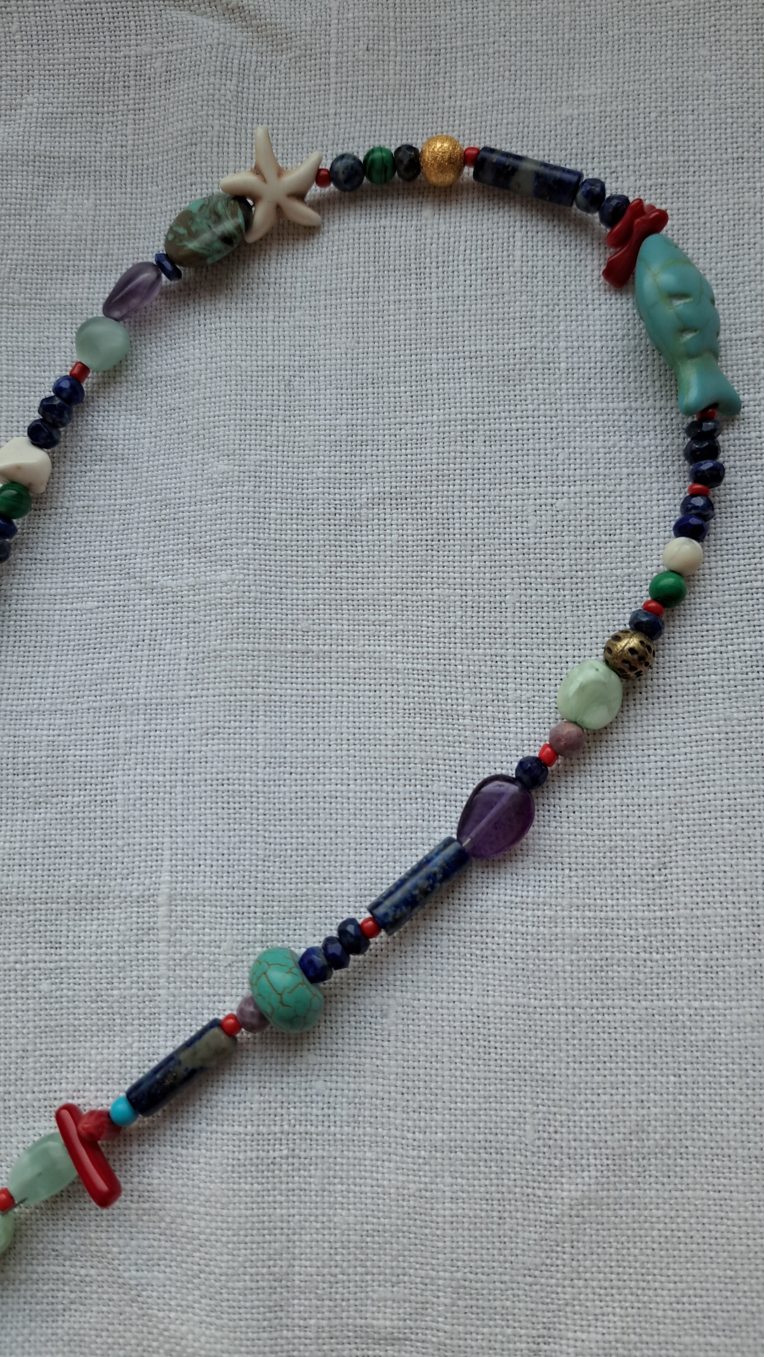 Mix of semi-precious stones and stainless steel marine details