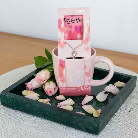 Gift set with ceramic mug, bracelet and hand cream